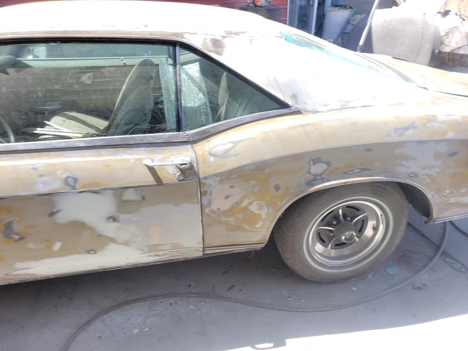 Classic car side panel restoration in progress at Victory Auto Body
